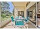 Screened lanai offers a comfortable dining space with views into the home and the landscaped backyard at 1032 Walnut Hill Ct, Spring Hill, FL 34609