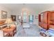Open-concept living room with high ceilings, a piano, and a view to the foyer at 1032 Walnut Hill Ct, Spring Hill, FL 34609