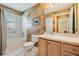Bathroom featuring a tub-shower combination and a vanity with ample storage at 1053 Winding Willow Dr, Trinity, FL 34655