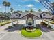 Well-maintained guard house entrance with manicured landscaping offering 24-hour security and peace of mind at 1053 Winding Willow Dr, Trinity, FL 34655
