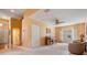 Inviting living room featuring a piano, neutral carpet, and ample natural light at 1053 Winding Willow Dr, Trinity, FL 34655