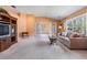 Spacious living room with vaulted ceilings and picturesque views of the lake at 1053 Winding Willow Dr, Trinity, FL 34655