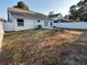 Fenced backyard with patio and mature trees, perfect for outdoor living at 10906 Carnelian Ln, Riverview, FL 33578