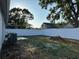 Spacious fenced backyard featuring well-maintained lawn and mature trees for privacy at 10906 Carnelian Ln, Riverview, FL 33578