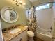 Bathroom with a granite countertop vanity, and a bathtub at 1121 Riveredge Dr, Tarpon Springs, FL 34689