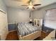 Bedroom with a bed, ceiling fan, and closet for optimal storage at 1121 Riveredge Dr, Tarpon Springs, FL 34689