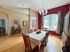 Formal dining room with wooden table set and decorative chandelier at 1121 Riveredge Dr, Tarpon Springs, FL 34689