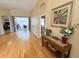 Inviting entryway with hardwood floors and a decorative console table at 1121 Riveredge Dr, Tarpon Springs, FL 34689