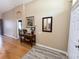 Inviting entryway with hardwood floors and a decorative console table at 1121 Riveredge Dr, Tarpon Springs, FL 34689