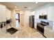Kitchen featuring stainless steel appliances, granite countertops, and wood-look floors at 1121 Riveredge Dr, Tarpon Springs, FL 34689