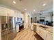 Kitchen featuring stainless steel appliances, granite countertops, and wood-look floors at 1121 Riveredge Dr, Tarpon Springs, FL 34689