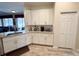 Kitchen featuring granite countertops, white cabinetry, and wood-look floors at 1121 Riveredge Dr, Tarpon Springs, FL 34689