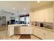 Bright kitchen with white cabinets, granite countertops, stainless steel appliances, and open floorplan at 1121 Riveredge Dr, Tarpon Springs, FL 34689