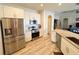 Kitchen featuring stainless steel appliances, granite countertops, and wood-look floors at 1121 Riveredge Dr, Tarpon Springs, FL 34689