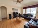 Comfortable living room with hardwood floors, modern entertainment system, and leather sofas at 1121 Riveredge Dr, Tarpon Springs, FL 34689