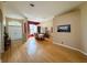 Spacious living room with hardwood floors, dining area, and natural light at 1121 Riveredge Dr, Tarpon Springs, FL 34689