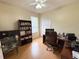 Home office with a desk and bookshelf for organized storage at 1121 Riveredge Dr, Tarpon Springs, FL 34689