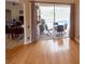 View of the patio furniture and pool from the living room through a sliding door at 1121 Riveredge Dr, Tarpon Springs, FL 34689
