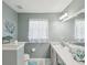 Cozy bathroom with a modern vanity, neutral walls, and themed accents creating a tranquil, clean space at 11342 Hollander Ave, Hudson, FL 34667