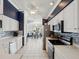 Open kitchen with stainless steel appliances, tile flooring and blue backsplash at 11342 Hollander Ave, Hudson, FL 34667