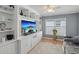 Inviting living room featuring a built-in entertainment center and a neutral color palette at 11342 Hollander Ave, Hudson, FL 34667