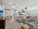 Living room with hardwood floors, neutral furniture, and open layout at 11342 Hollander Ave, Hudson, FL 34667