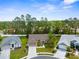 Charming single-story home featuring a well-maintained lawn and lush landscaping in a quiet neighborhood at 11443 Marsh Creek Ct, New Port Richey, FL 34654