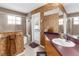 Bathroom features a shower-tub combo, a large mirror and a door to the pool area at 11443 Marsh Creek Ct, New Port Richey, FL 34654