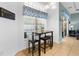 Sunny dining nook with tile flooring, perfect for casual meals with Gathering and friends with views of the pool at 11443 Marsh Creek Ct, New Port Richey, FL 34654