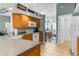 Well-equipped kitchen with natural wood cabinets and views into the breakfast nook at 11443 Marsh Creek Ct, New Port Richey, FL 34654