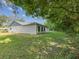 Large backyard offers plenty of green space for recreation and relaxation at 11512 Yellow Birch Ct, New Port Richey, FL 34654