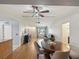 Open-concept layout seamlessly connecting the dining room, living room, and kitchen at 11512 Yellow Birch Ct, New Port Richey, FL 34654