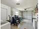 Spacious garage with overhead door, shelving, and ample storage space at 11512 Yellow Birch Ct, New Port Richey, FL 34654