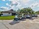 Several golf carts parked outside the golf club at 11512 Yellow Birch Ct, New Port Richey, FL 34654