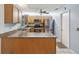 Beautiful kitchen with granite countertops, stainless steel appliances, and ample cabinet space at 11512 Yellow Birch Ct, New Port Richey, FL 34654