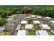 Aerial shot of a neighborhood showcasing single-story homes surrounded by lush greenery at 11601 Bayonet Ln # 163A2, New Port Richey, FL 34654