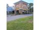 An attractive community entrance with stone pillars, and lovely landscape at 11601 Bayonet Ln # 163A2, New Port Richey, FL 34654