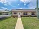 Charming single story home boasts stone accents and a metal roof for lasting beauty at 11601 Bayonet Ln # 163A2, New Port Richey, FL 34654