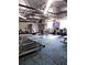 Bright fitness center with treadmills, weight machines and mounted TV at 11601 Bayonet Ln # 163A2, New Port Richey, FL 34654