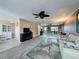 Bright living room with a full wall mirror and seamless access to the dining area at 11601 Bayonet Ln # 163A2, New Port Richey, FL 34654