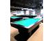 Spacious game room featuring multiple pool tables under bright lights at 11601 Bayonet Ln # 163A2, New Port Richey, FL 34654