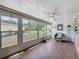 Enclosed patio with tile flooring and ample sunlight showcasing outdoor views at 11601 Bayonet Ln # 163A2, New Port Richey, FL 34654