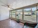 Enclosed patio with tile flooring offering a tranquil view of the home's backyard at 11601 Bayonet Ln # 163A2, New Port Richey, FL 34654