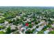 Expansive aerial shot showcasing a charming neighborhood with lush greenery and well-maintained homes at 12407 Gunstock Ln, Hudson, FL 34667