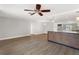 Bright open-concept kitchen and living area with modern finishes at 12407 Gunstock Ln, Hudson, FL 34667