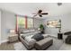 Bedroom with stylish furniture, soft lighting, and a ceiling fan at 12407 Gunstock Ln, Hudson, FL 34667