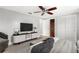 Bedroom with stylish furniture, a ceiling fan, and closet at 12407 Gunstock Ln, Hudson, FL 34667