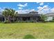 Expansive backyard with mature trees and lush green grass at 12539 Wetmore Ct, Odessa, FL 33556