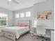 Bright bedroom featuring a small desk, carpet floors, neutral paint and a large window at 12539 Wetmore Ct, Odessa, FL 33556
