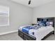 Charming bedroom decorated with NY Yankees theme, with carpet and a window at 12539 Wetmore Ct, Odessa, FL 33556